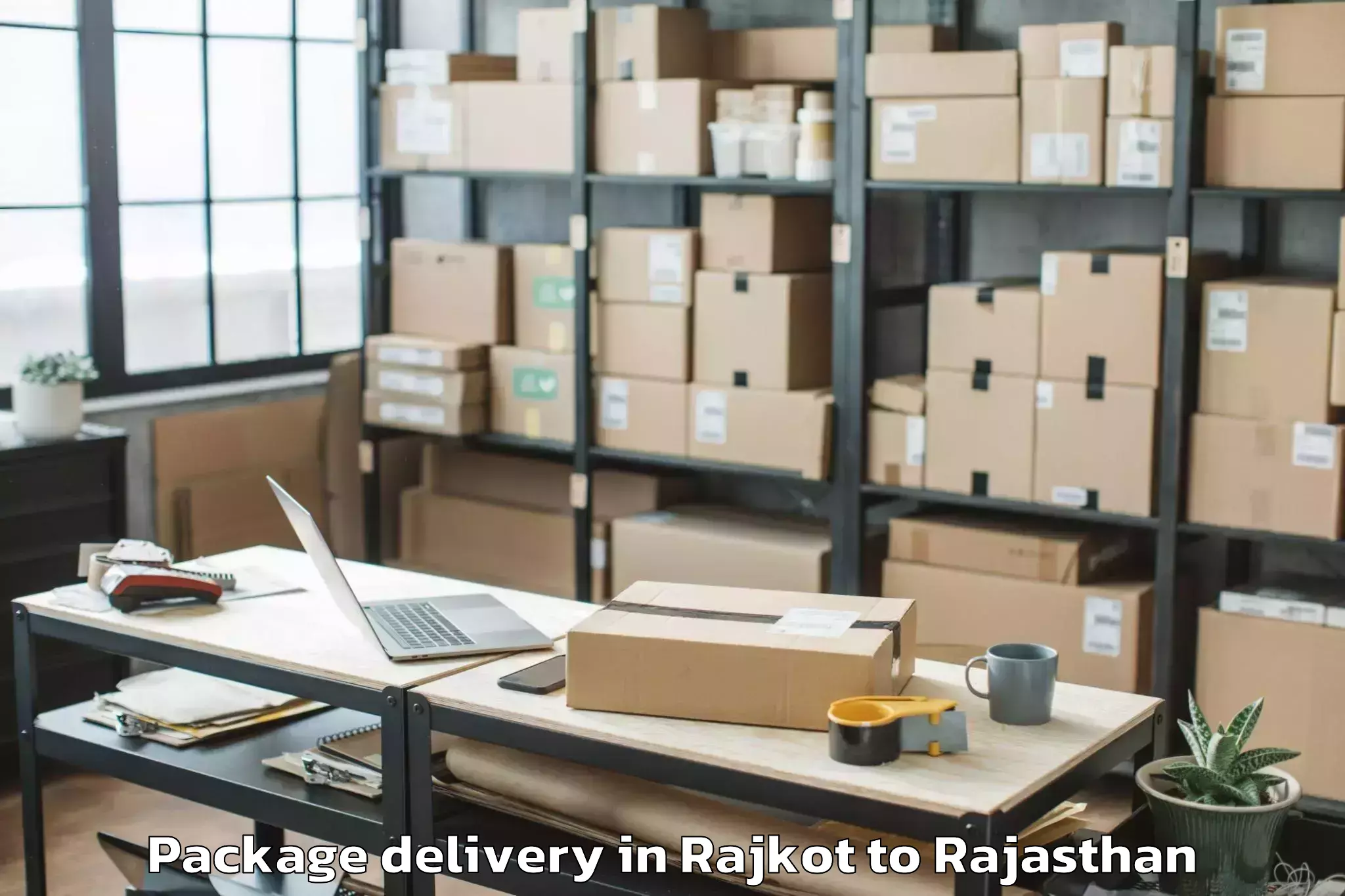 Top Rajkot to Jaipur National University Jai Package Delivery Available